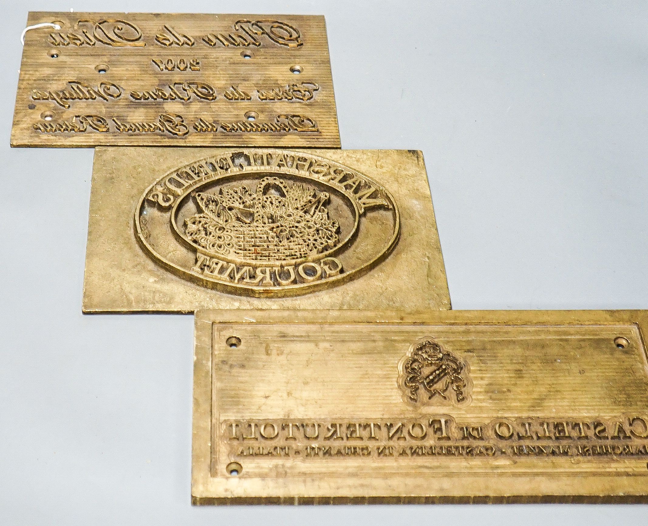 Three wine related brass printing plates